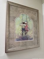 angled view of framed artwork on wall