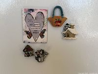 All five decorative fridge magnets arranged on refrigerator surface