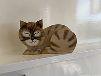 Front view showing painted face and tabby markings