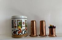 tin and three copper pieces group view