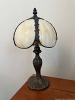 Front view of slag glass lamp showing shade and base