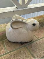 Left-front view of small ceramic rabbit figurine