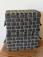 Front view of stacked woven storage boxes