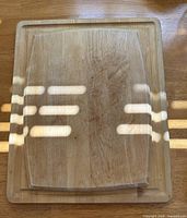 both wooden cutting boards showing size relation