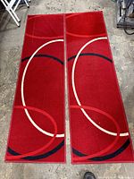 Both runner rugs laid side by side showing full geometric design and overall wear
