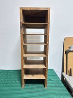 Front view showing six shelves and overall height