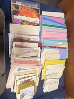 Overview of stacked cards and envelopes on table