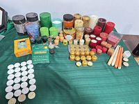 Overview of entire candle lot on green table