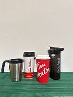 Front view of all four mugs standing upright