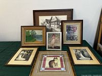 Group shot of all seven framed artworks displayed together