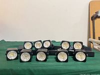 Front view showing 10 black track light heads