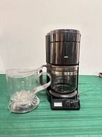 Front view of Braun coffee maker with Grosche brewer beside