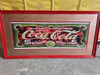 Front view of framed Coca-Cola sign
