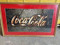 Front view of framed Coca-Cola print showing artwork, mat and frame