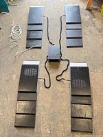 Top-down view of four platforms with power box and cables