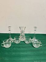 group shot showing vase, candlesticks, and four handled cups