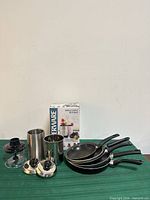 group shot showing pans, lids, stainless cups, chopper bowl, Farberware blender box