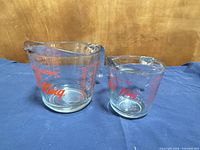 Both measuring cups front view showing sizes and printed markings