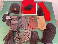 All items laid out: gloves, ice cleats, balaclava, beanie, scarves, socks