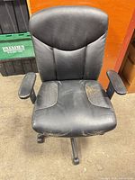 Front view showing seat, armrests, base and wear