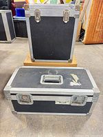 Both flight cases front view showing sizes and exterior condition
