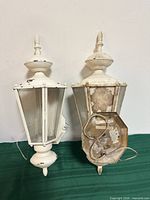 front view of both lantern sconces showing overall design and condition