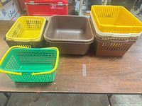All baskets and tubs grouped on table showing colors and sizes