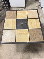 Top view showing nine ceramic-stone tiles and umbrella hole