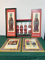Group shot of all five framed Coca-Cola prints