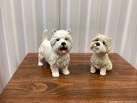 Front view of both West Highland White Terrier figurines