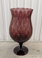 Full side view showing entire vase shape, color and pedestal base