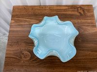 Top view of blue opalescent ruffled glass bowl