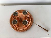 Top view of tray, four cups, and stirrer