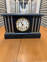 Front view of Ingraham mantel clock showing case, columns and dial