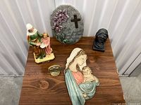 Group shot showing all four religious pieces on table