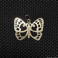 Front view of openwork butterfly pendant
