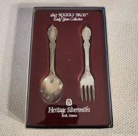 Boxed 1847 Rogers Bros spoon and fork set with branding visible