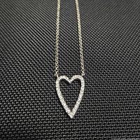 Necklace laid out showing full chain and heart pendant