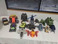 Full table view of all plastic vehicle toys