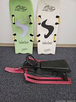Front view of sled and both bodyboards upright showing tops, brand logos and colours