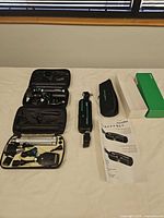 overall lot with cases open, pouch, sleeve box and instruction sheet visible
