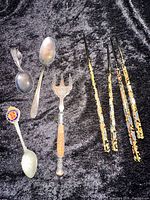 Group shot of bread fork, spoons and chopsticks