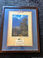 Full view of framed print showing artwork, mat, calendar pad and frame