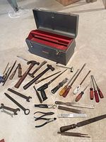 Entire lot laid out: toolbox open with red tray and all tools displayed on floor