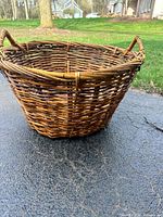 Side view showing woven structure and handles