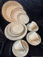 Full view of all plates, cups, and saucers