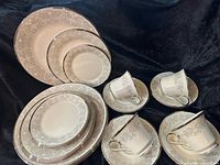 All china pieces arranged showing pattern and counts