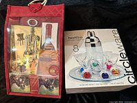 Both gift sets: boxed Circleware Bonfire martini set and red wine accessory bag