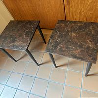 Two square MCM tables with marble-look tops and tapered legs