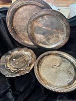 Group view of three trays and glass dish